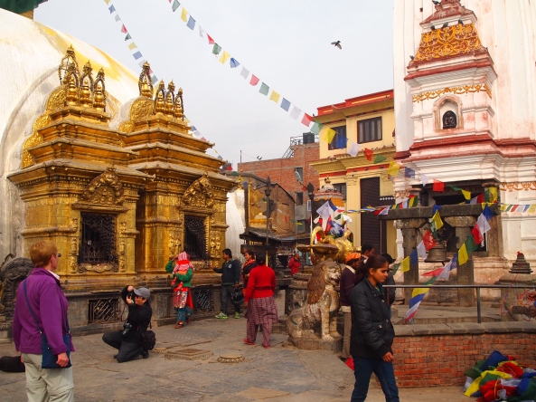 pilgrims and tourists rove around the stupa