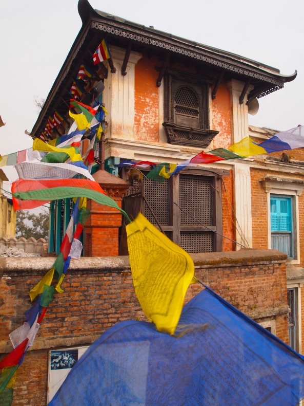 colorful prayer flags representing the 5 elements of earth, water, air, fire & sky