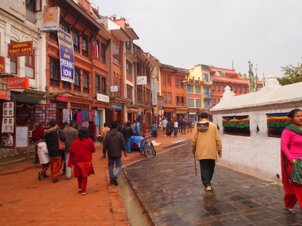 pilgrims & tourists walk clockwise around the Boudha stupa