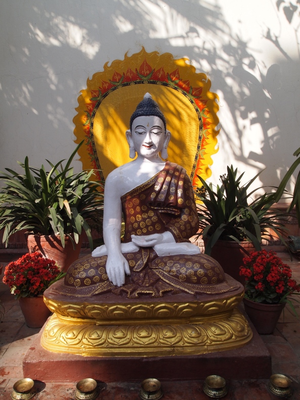 the meditative Buddha in the courtyard of Kathmandu Guest House